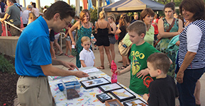 Instructor teaching kids about butterflies