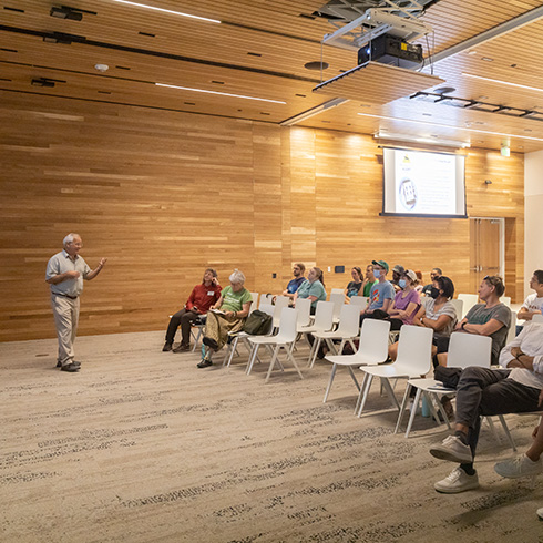 lecture taking place in open, airy lecture hall