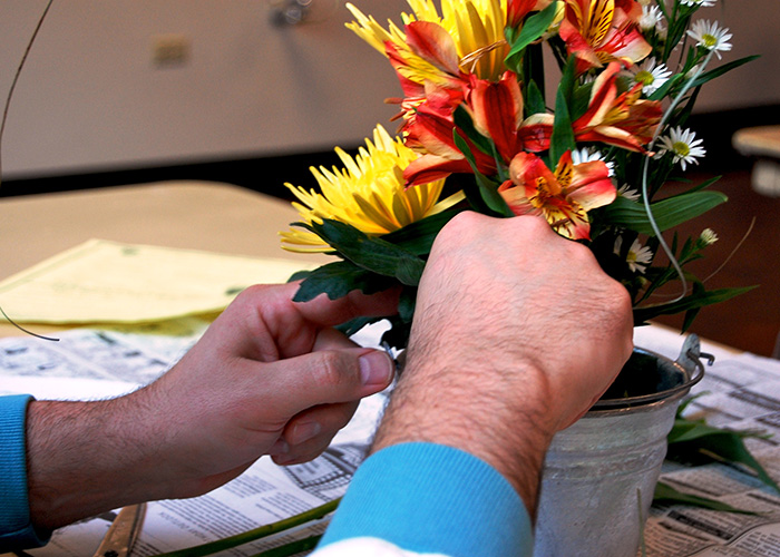 Man arranging flowers