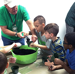 Volunteer potting plants with students