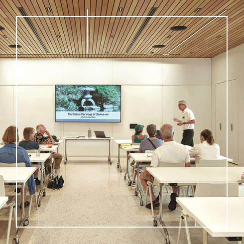 group leader presenting in modern classroom setting