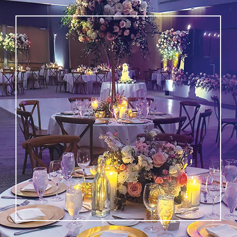 Reception table centerpiece in purple light